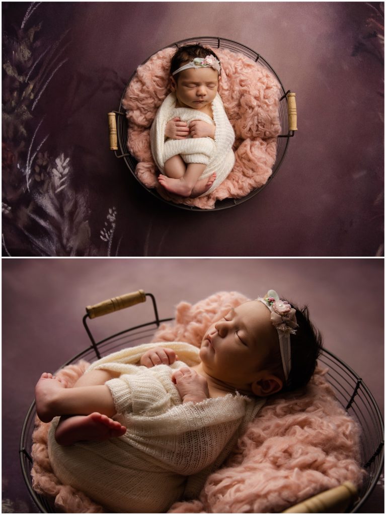 Baby in cream swaddle with dark dusty pinks.